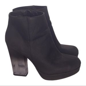 black transparent heeled booties with zipper closure